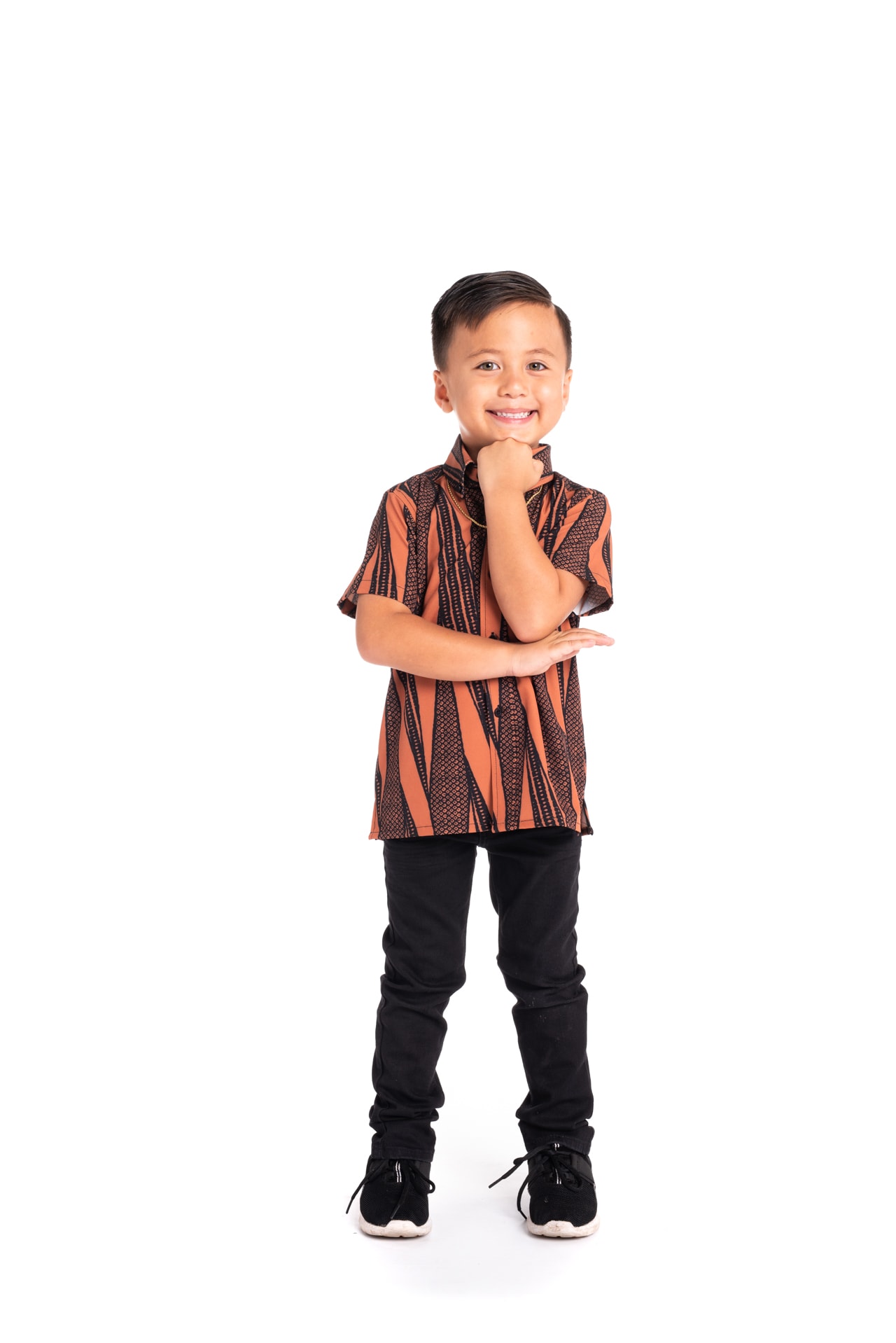 Boy wearing Keiki Mahalo Shirt S-S in Kialoa Copper Brown