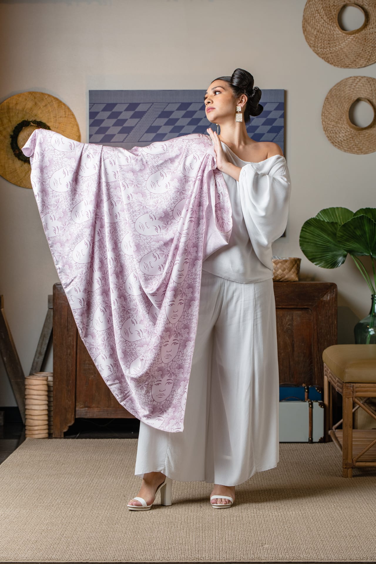 Model holding up a Kihei in Purple