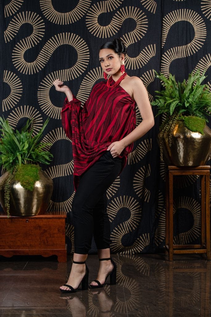 Model wearing Pareo shawl in Firey Red Black