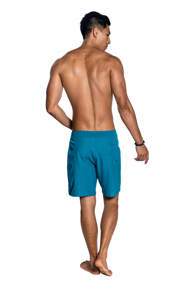 Male model wearing 4 Way Stretch Bottoms in Peasant Blue Niau - Back View