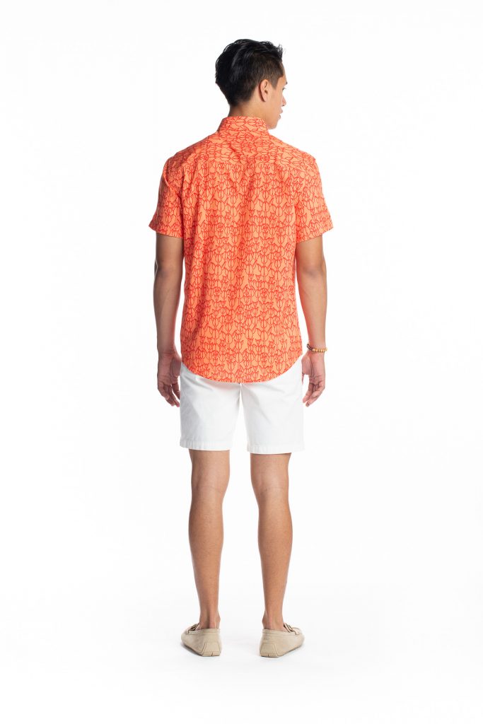 Male model wearing Hula Shirt S-S in Musk Melon/Firey Red Kapualiko - Back View