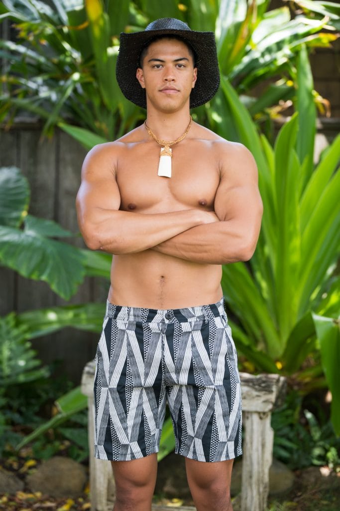 Male model wearing Keola Shorts in Black Windchime Kanaloa Pattern - Front View