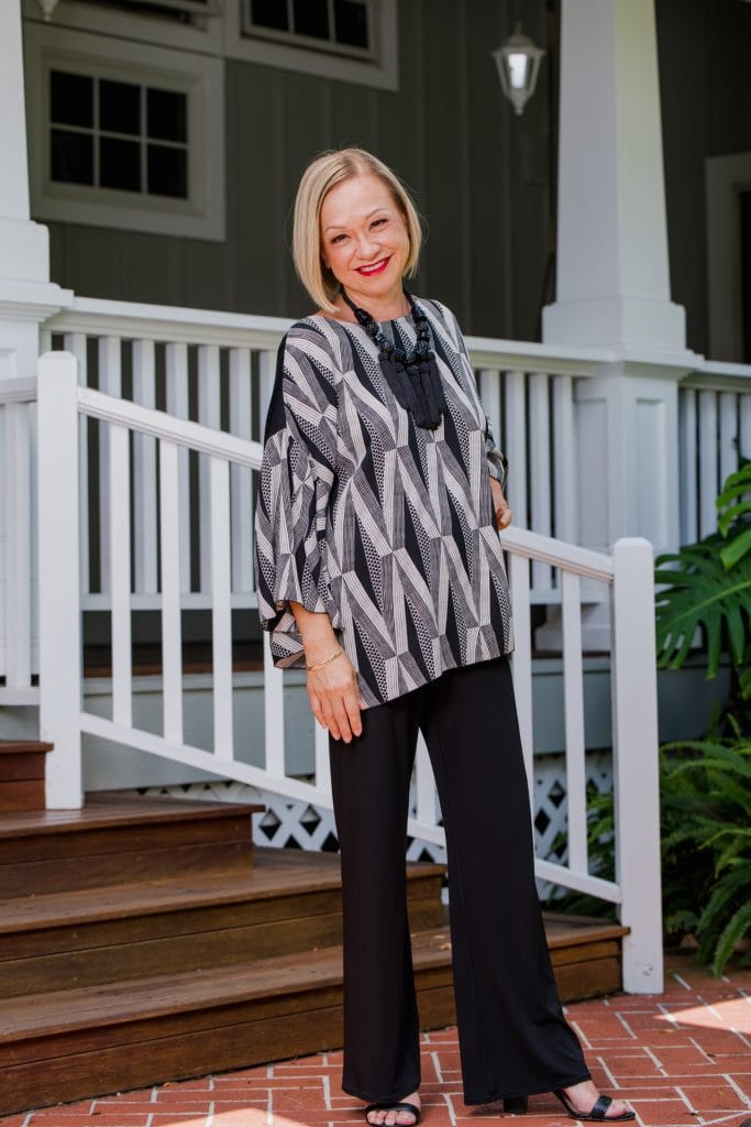 Model wearing Hoolaulea Top in Black Windchime Kanaloa Pattern - Front View