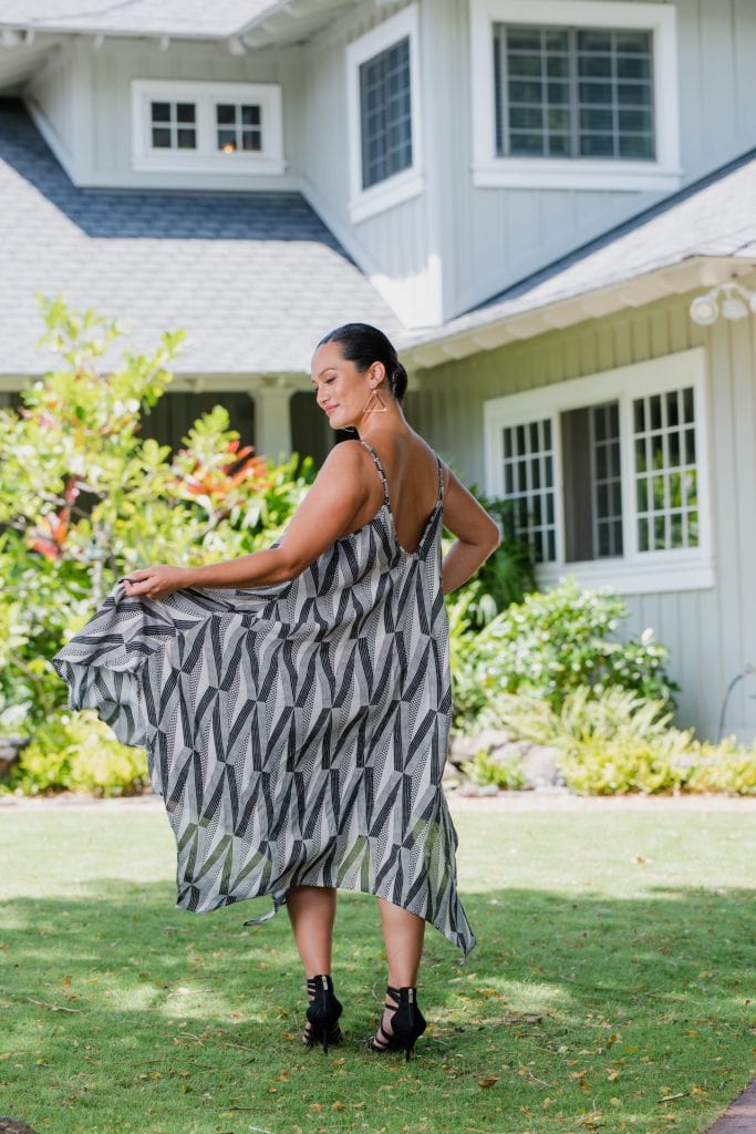 Model wearing Pualahilani Dress in Black Windchime Kanaloa Pattern - Back View