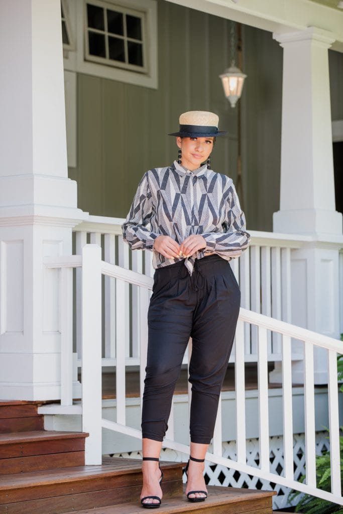 Model Wearing Top Sexetary in Windchine Black Kanaloa Pattern - Front View