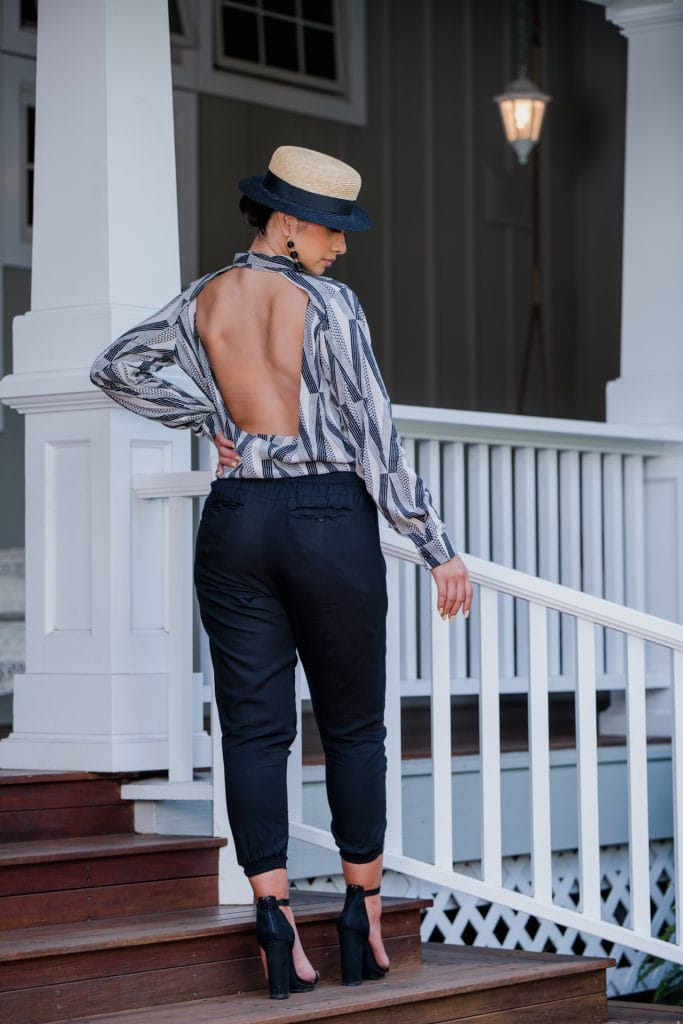 Model Wearing Top Sexetary in Windchine Black Kanaloa Pattern - Back View