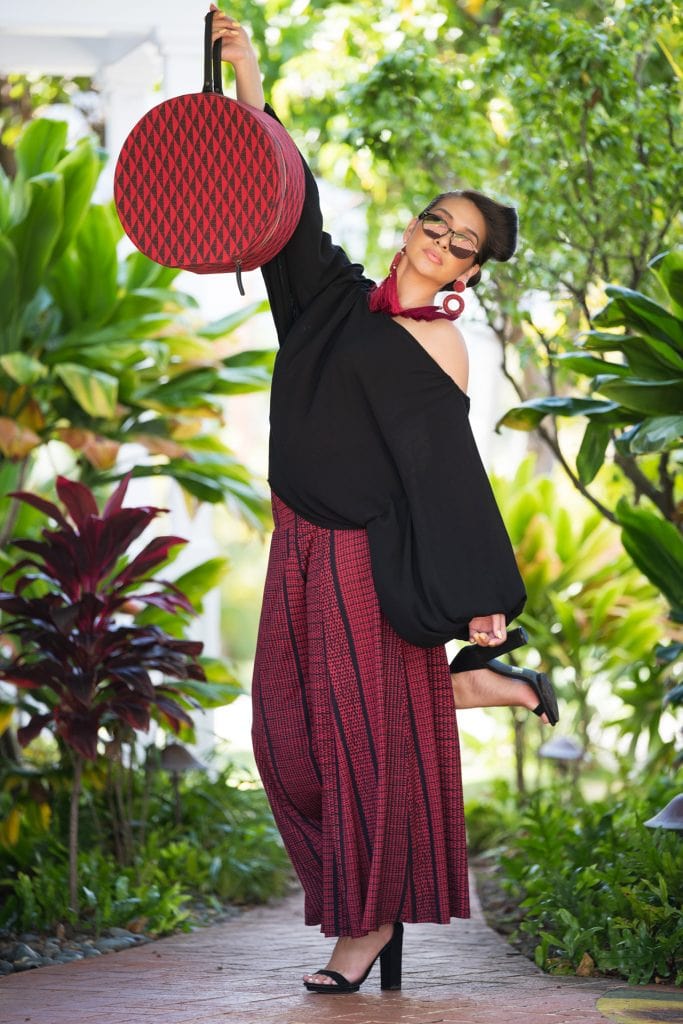 Model wearing Huakai Pant in Deepwell Brick Red Nihoku Pattern - Front View