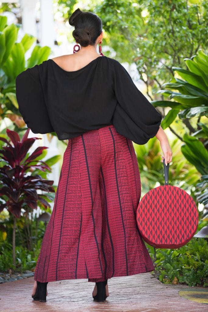 Model wearing Huakai Pant in Deepwell Brick Red Nihoku Pattern - Back View
