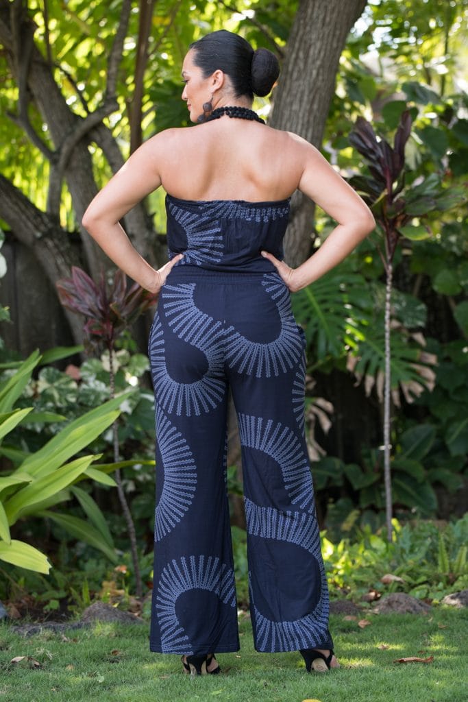Model wearing Pakalana Jumpsuit in Deepwell Folkstone Grey Lalainkalalea Pattern - Back View