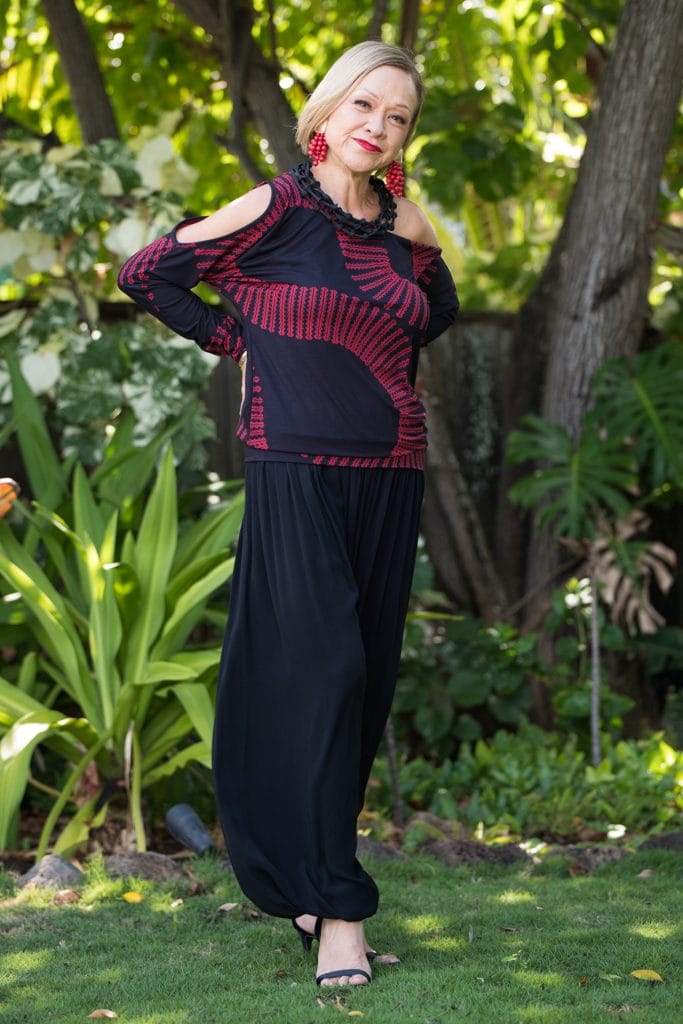 Model wearing Kipoohiwi Top in Deepwell Brick Red Lalani Kalalea Pattern - Front View