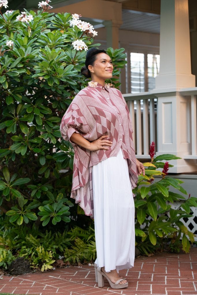 Female model wearing Top Aali'i in Fired Brick White Kamehameha Pattern - Side View