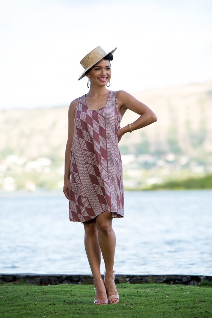 Model wearing Kaimanahila Short Dress in Fired Brick-White Kamehahema Pattern - Front View