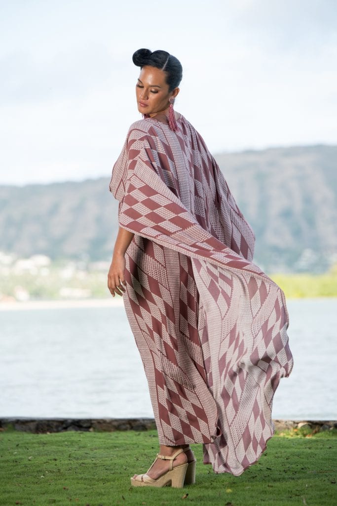 Model wearing Manu O'O Dress in Fired Brick-White Kamehameha Pattern - Back View
