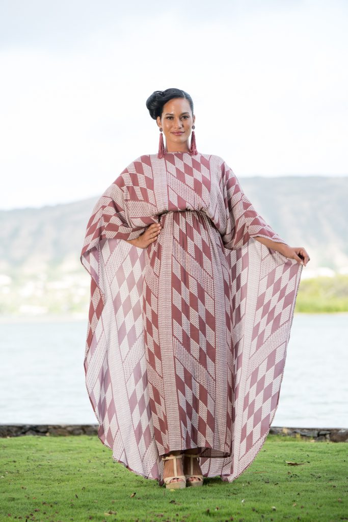 Model wearing Manu O'O Dress in Fired Brick-White Kamehahema Pattern - Front View
