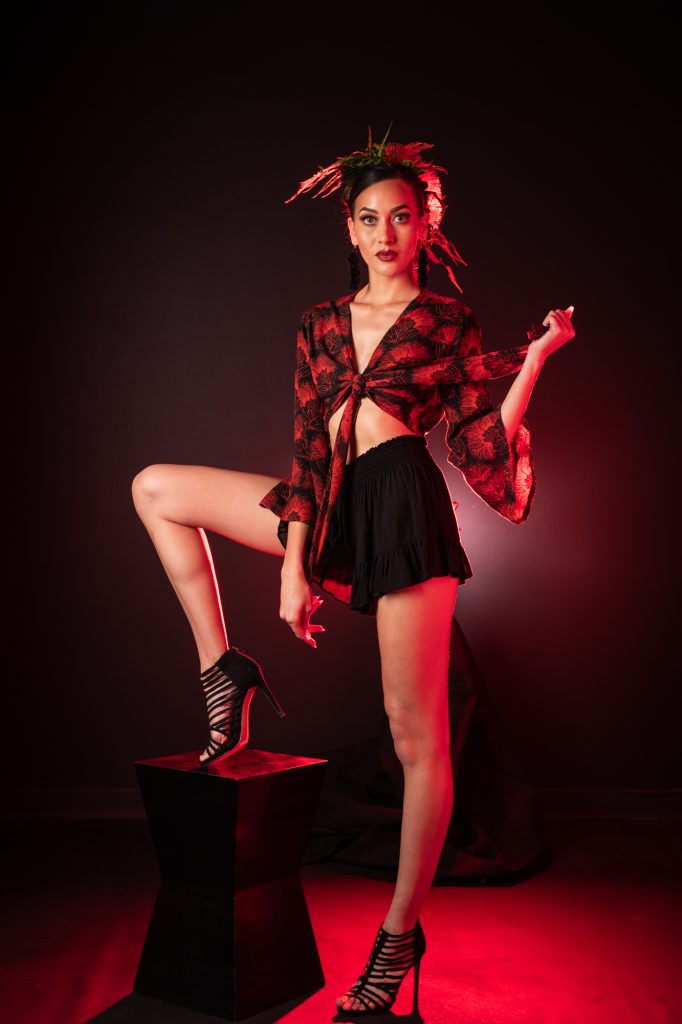 Model wearing Lako Top in Black Firey Red Kalihilehua Pattern- Front View