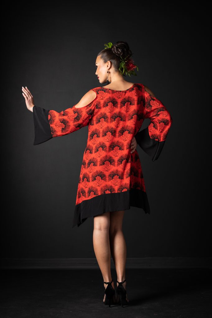 Model wearing Kamakana Top with Pocket in Firey Red-Black Kalihilehua Pattern - Back View