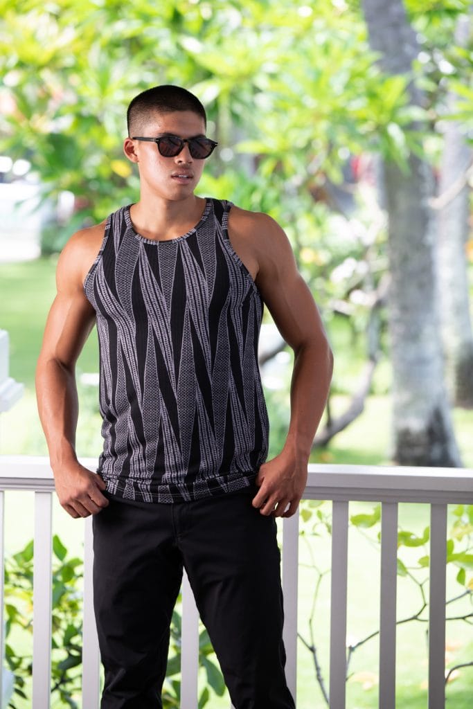Male model wearing Kawelo Ribbed Tank in Jet Black Silver Filigree Kialoa Pattern - Front View