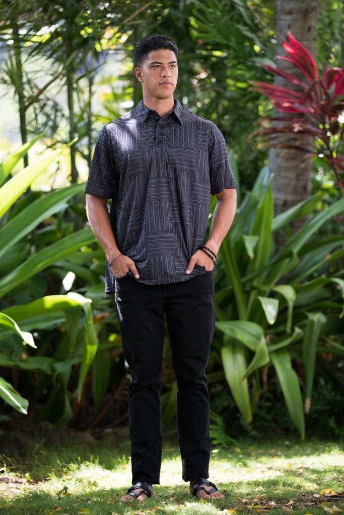 Male model wearing Golf Aloha Button Shirt in Blackened Pearl Black Ulana Pattern - Front View