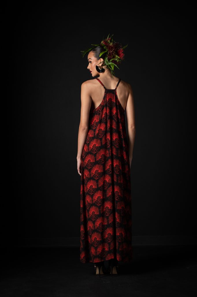Model wearing Lanihau Dress in Black Fiery Red Kalihilehua Pattern- Back View