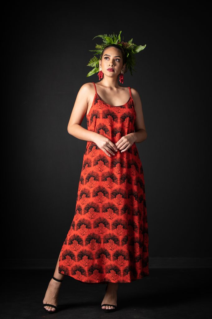 Model wearing Uluniu Maxi Dress in Firey Red-Black Kalihilehua Pattern - Front View