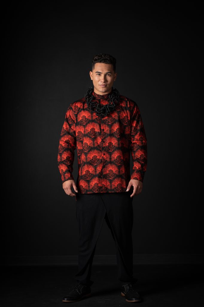 Male model wearing Pake Shirt in Black Firey Red Kalihilehua Pattern - Front View