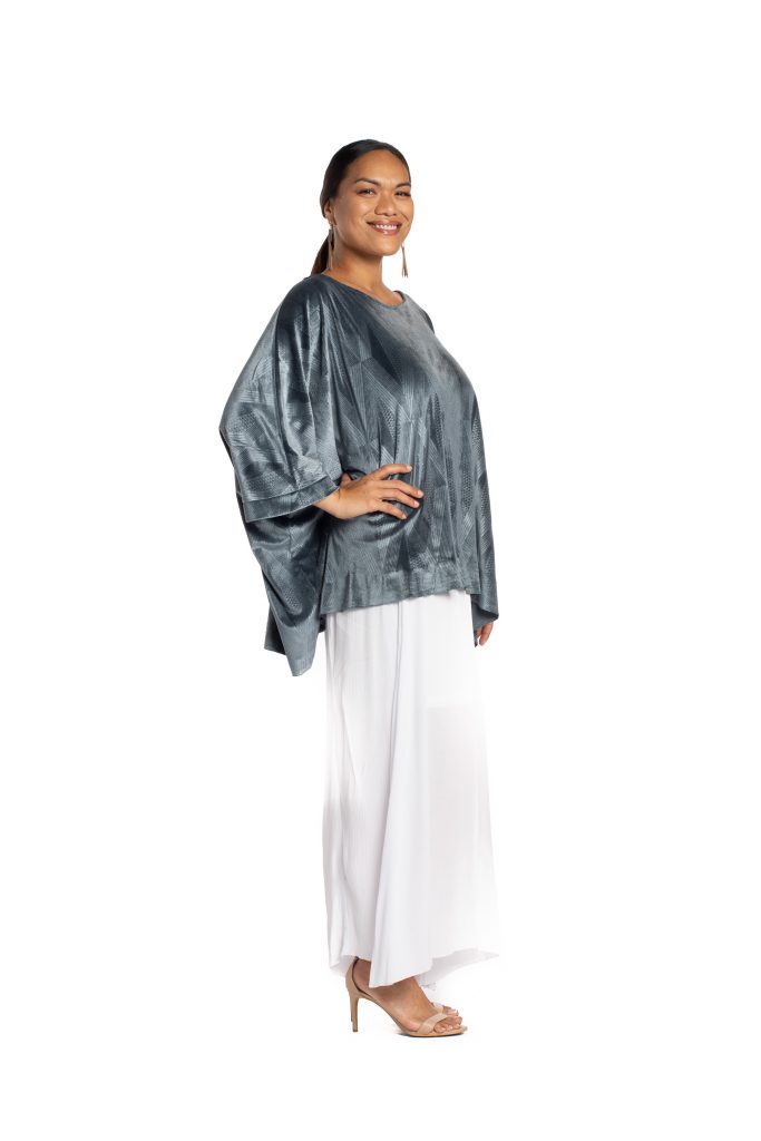 Model wearing Pakele Top in Sharkskin Kanaloa Pattern- Side View