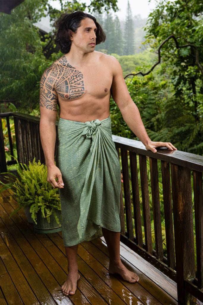 Male model wearing Lily Pad Margarita Pareo wrap in Kupukupu pattern