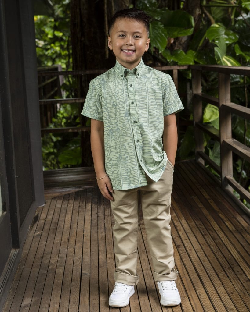 Boy wearing Keiki Shirt in Lily Pad Margarita Kupukupu pattern