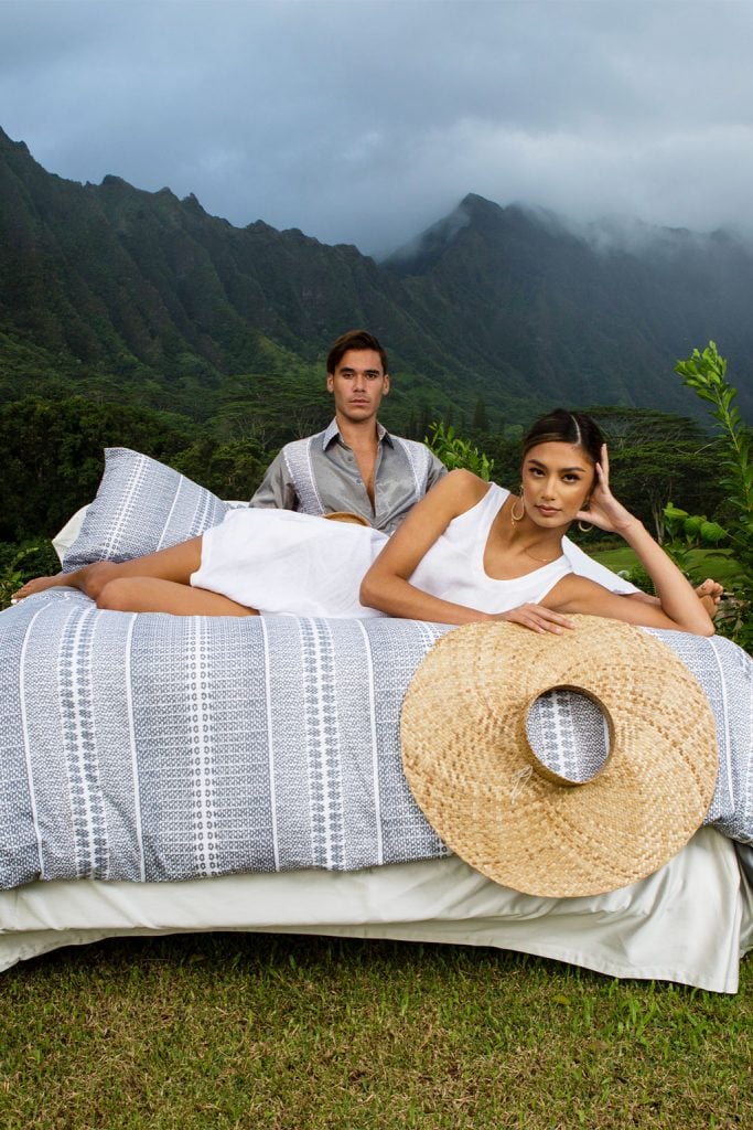 Male and Female Model laying on Manaola Duvet Queen Set in Stone Akoakoa Pattern