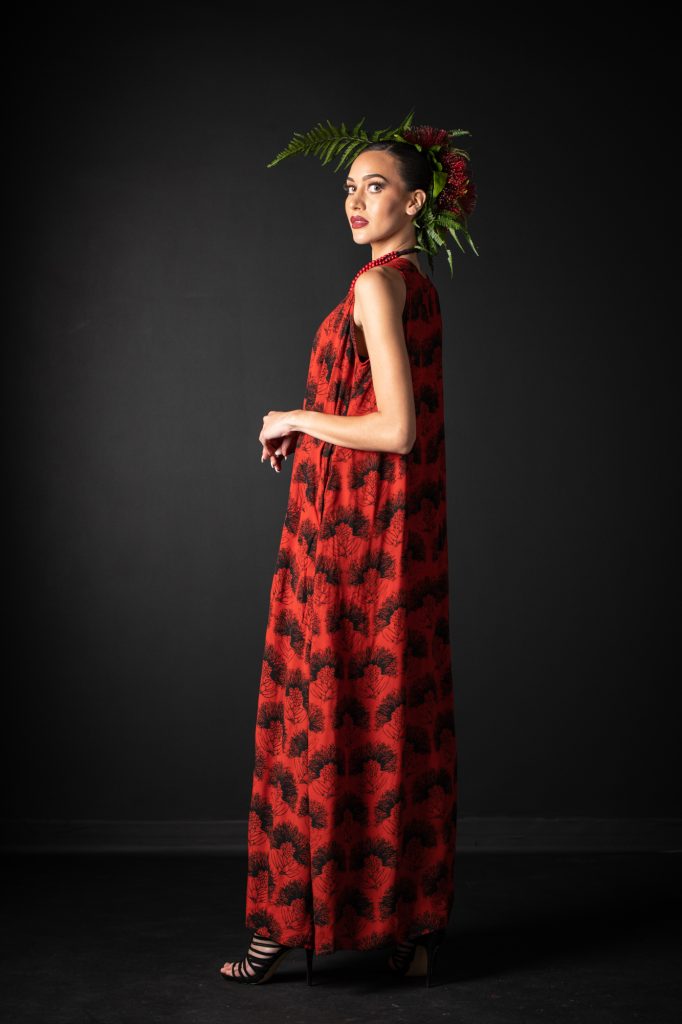 Model wearing Malia Long Dress in Firey Red-Black Kalihilehua Pattern- Side View