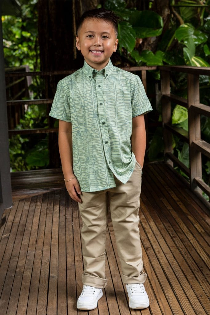 Boy wearing Keiki shirt in Lily Pad Margarita Kupukupu pattern front view