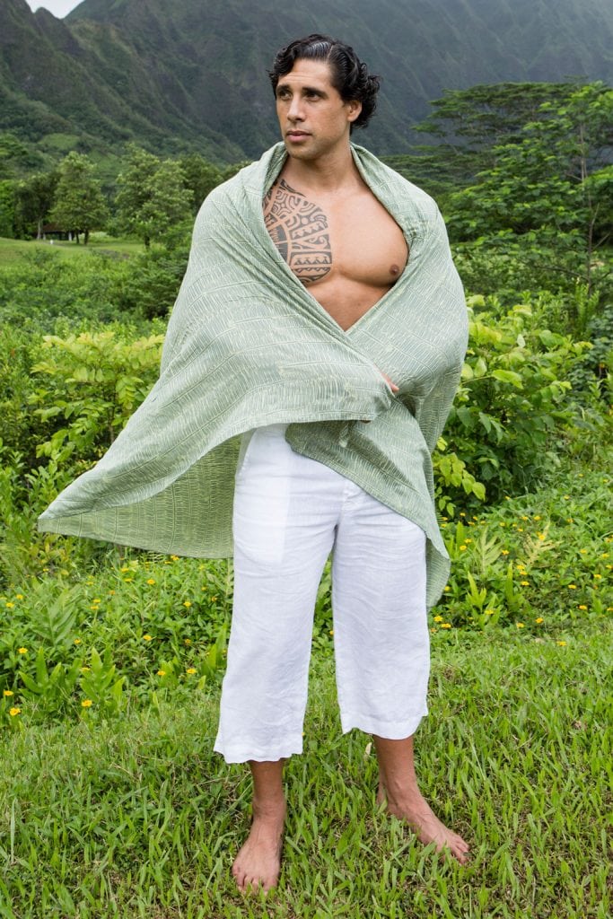 Male model wearing Pareo wrap in Margarita Lily Pad Kupukupu pattern