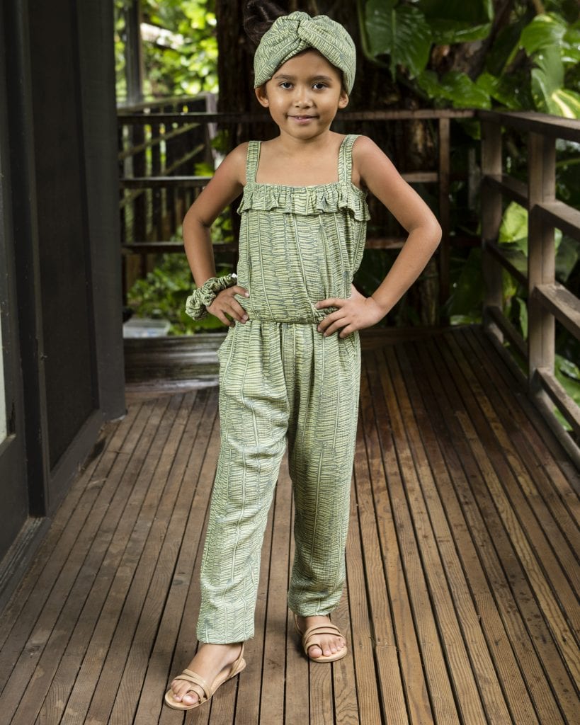 Child wearing Top Penny top in Margarita Lily Pad Kupukupu pattern