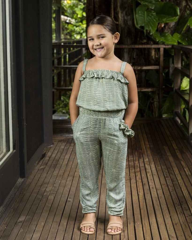 Child wearing top penny in Lily Pad Margarita Kupukupu pattern