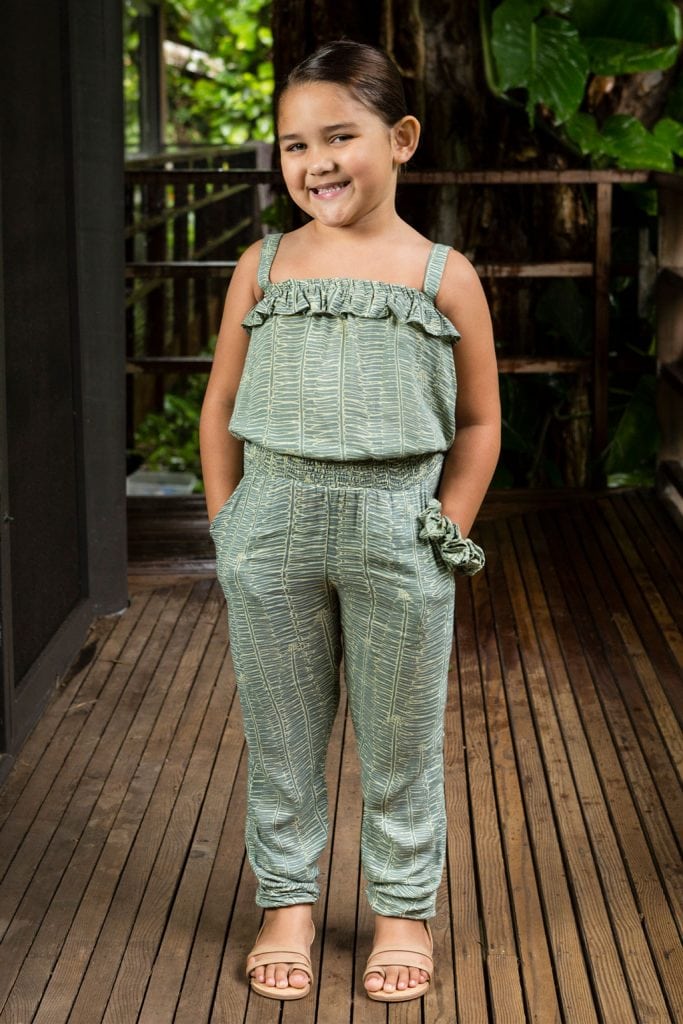 Child wearing top penny in Lily Pad Margarita Kupukupu pattern