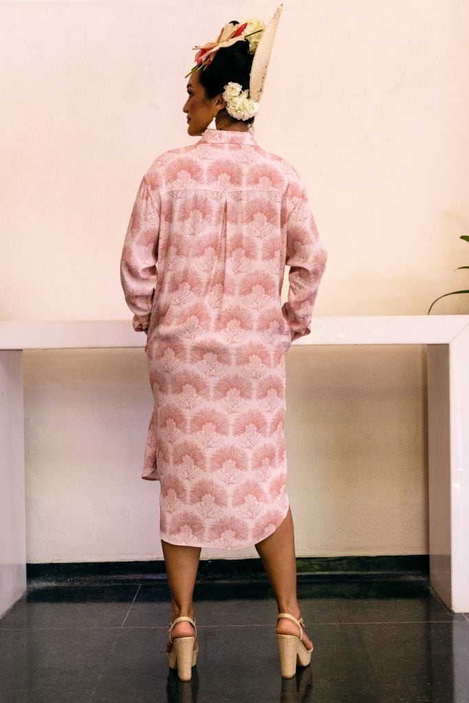 Female model wearing Ulupono Dress in Kalihilehua Pattern and Ash Rose-Lotus Color - Back View