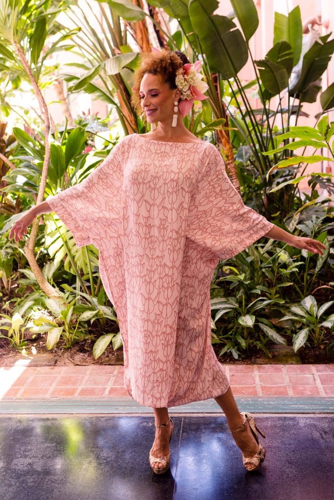 Female Model wearing Hilu Hulu Kaftan Dress in Kapualiko Pattern in an Ash Rose-Lotus Color - Front View