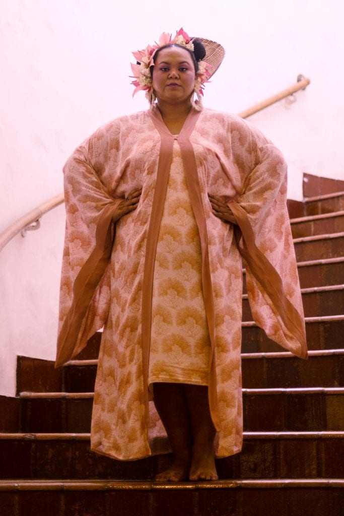 Female Model wearing a Kaliko Kaftan in a Kalihilehua Pattern in Lotus-Ash Rose Color - Front View