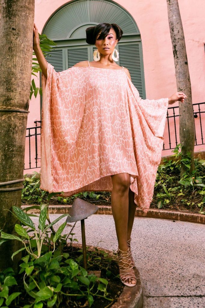 Female model wearing a Malama Top in Kapualiko Pattern - Front View