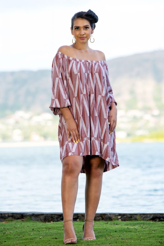 Female Model wearing a Healani Top in a Kanaloa Pattern and Fired Brick-White - Front View