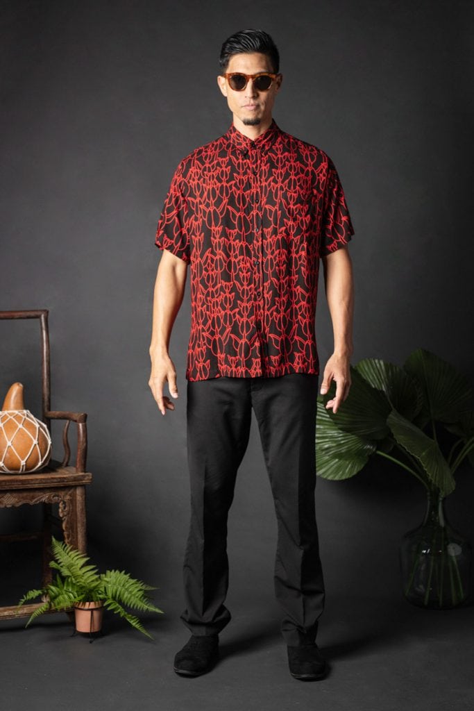 Male model wearing Aloha Shirt S-S in a Kapualiko Pattern and Black-Fiery Red - Front View
