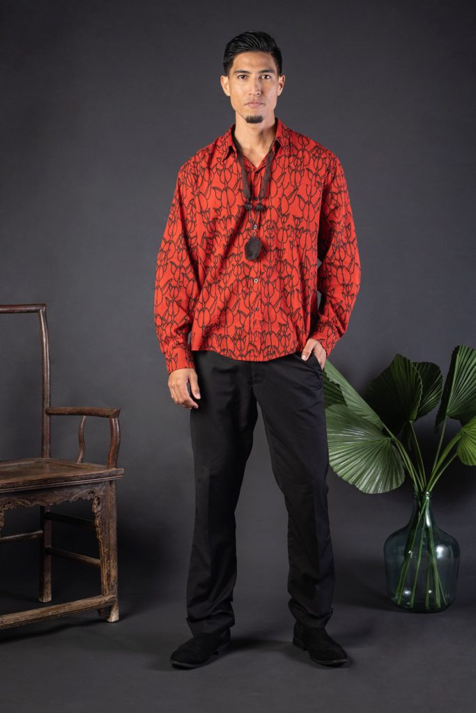 Male model wearing Hilo Shirt L-S in a Kapualiko Pattern and Fiery Red-Black - Front View