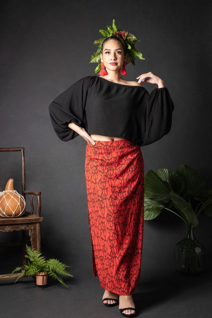 Female model wearing Kahiki Skirt Long in a Kapualiko Pattern in Fiery Red-Black - Front View