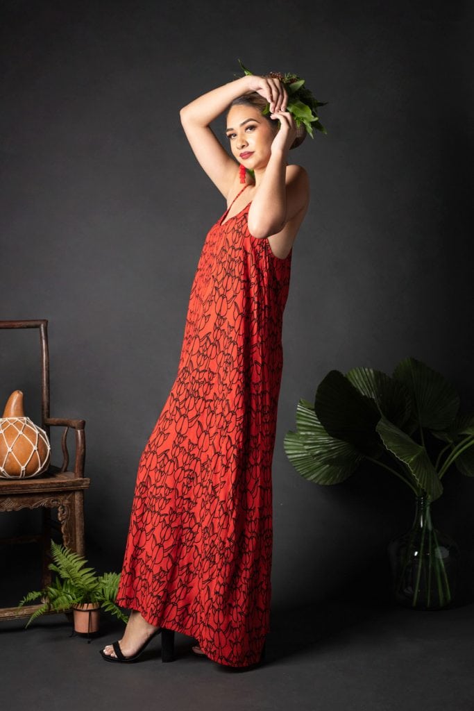 Female model wearing Keahou Dress in a Kapualiko Fiery Red/Black Color - Side View