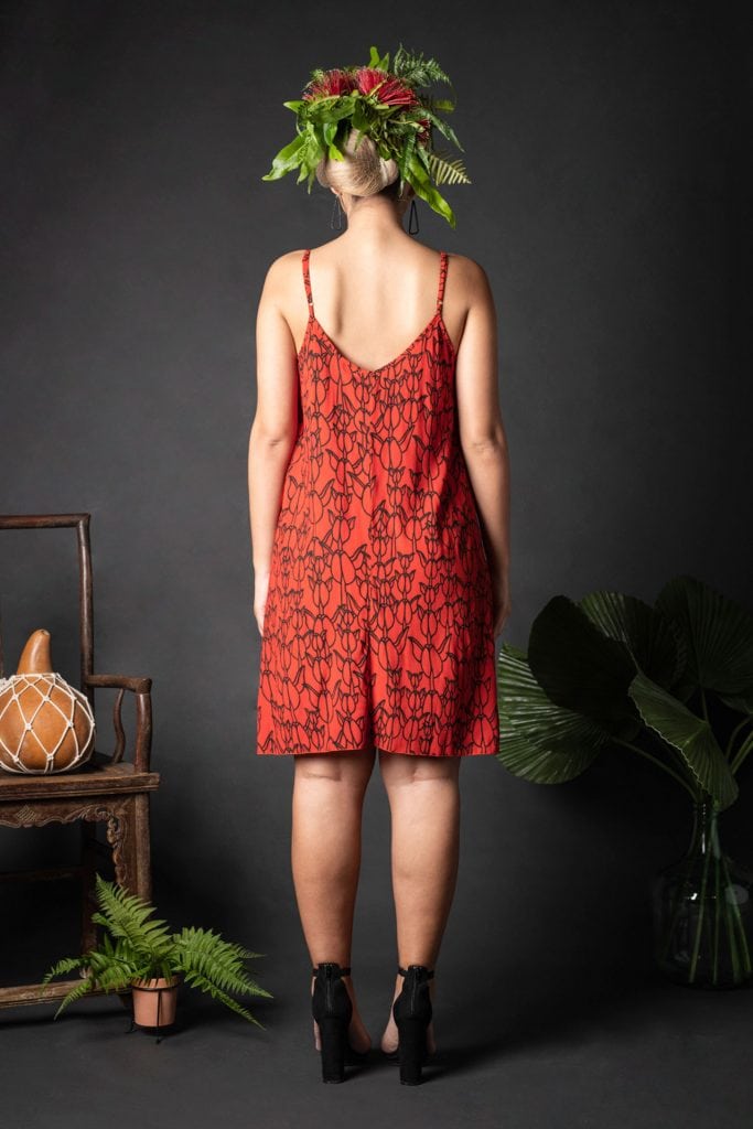 Female model wearing Kuakini Short Dress in a Kapualiko Pattern in Black-Fiery Red - Back View