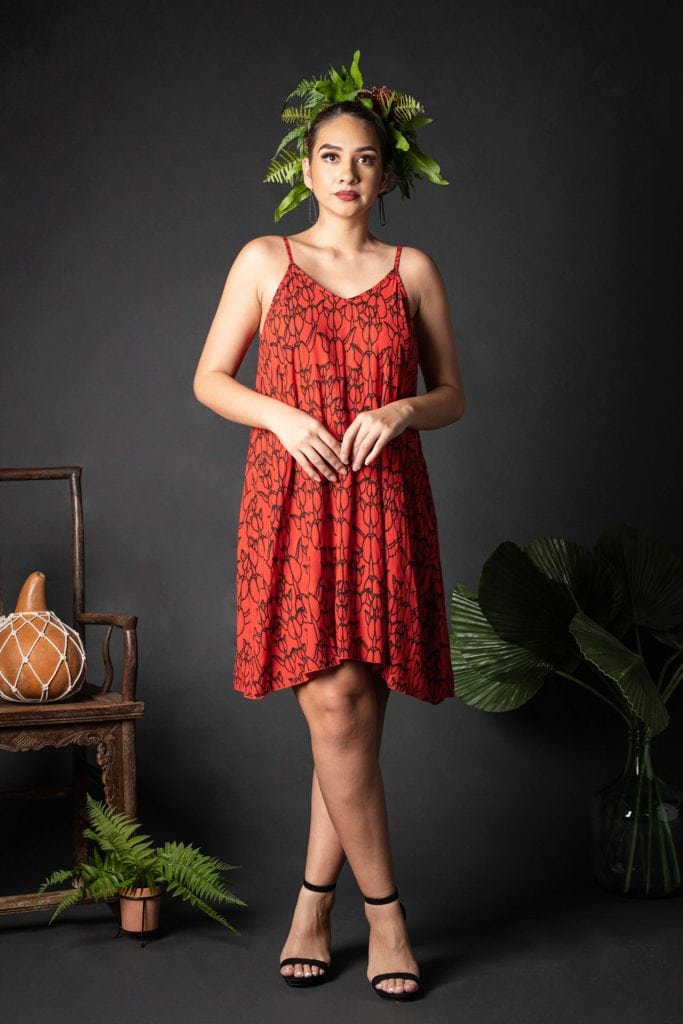 Female model wearing Kuakini Short Dress in a Kapualiko Pattern in Black-Fiery Red - Front View