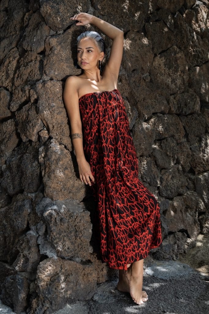 Female model wearing a Pareo in Kapualiko Pattern and Blk/Firey Red Color - Front View