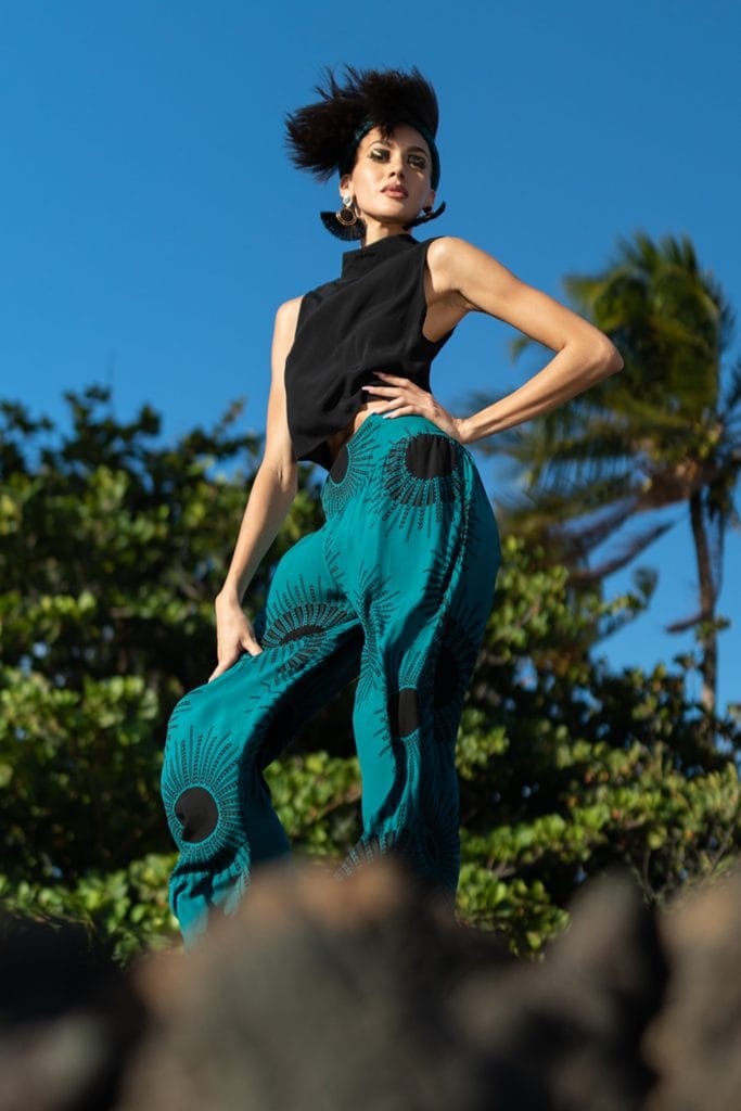 Female model wearing Kaiopae Pants in in Dragonfly/Black Color and Kanehoalani Pattern - Front View