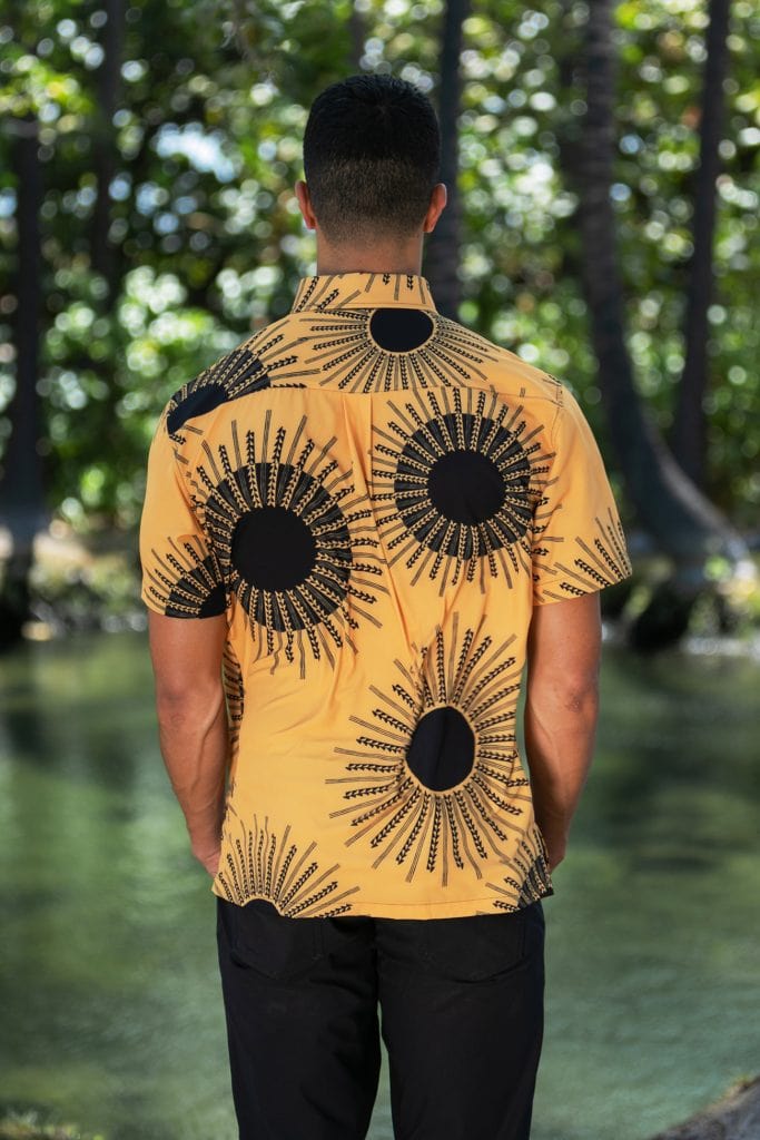Male model wearing Mahalo Shirt in Kanehoalani Pattern in Mustard - Back View