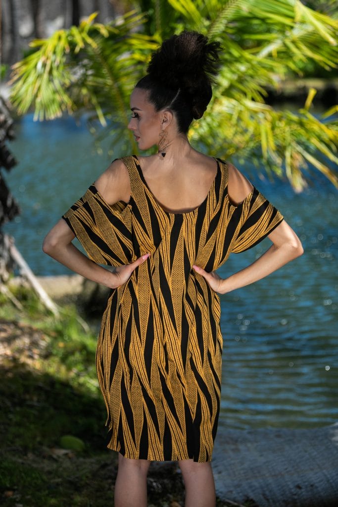 Female model wearing Holunape Dress in Kanehoalani Pattern - Back View